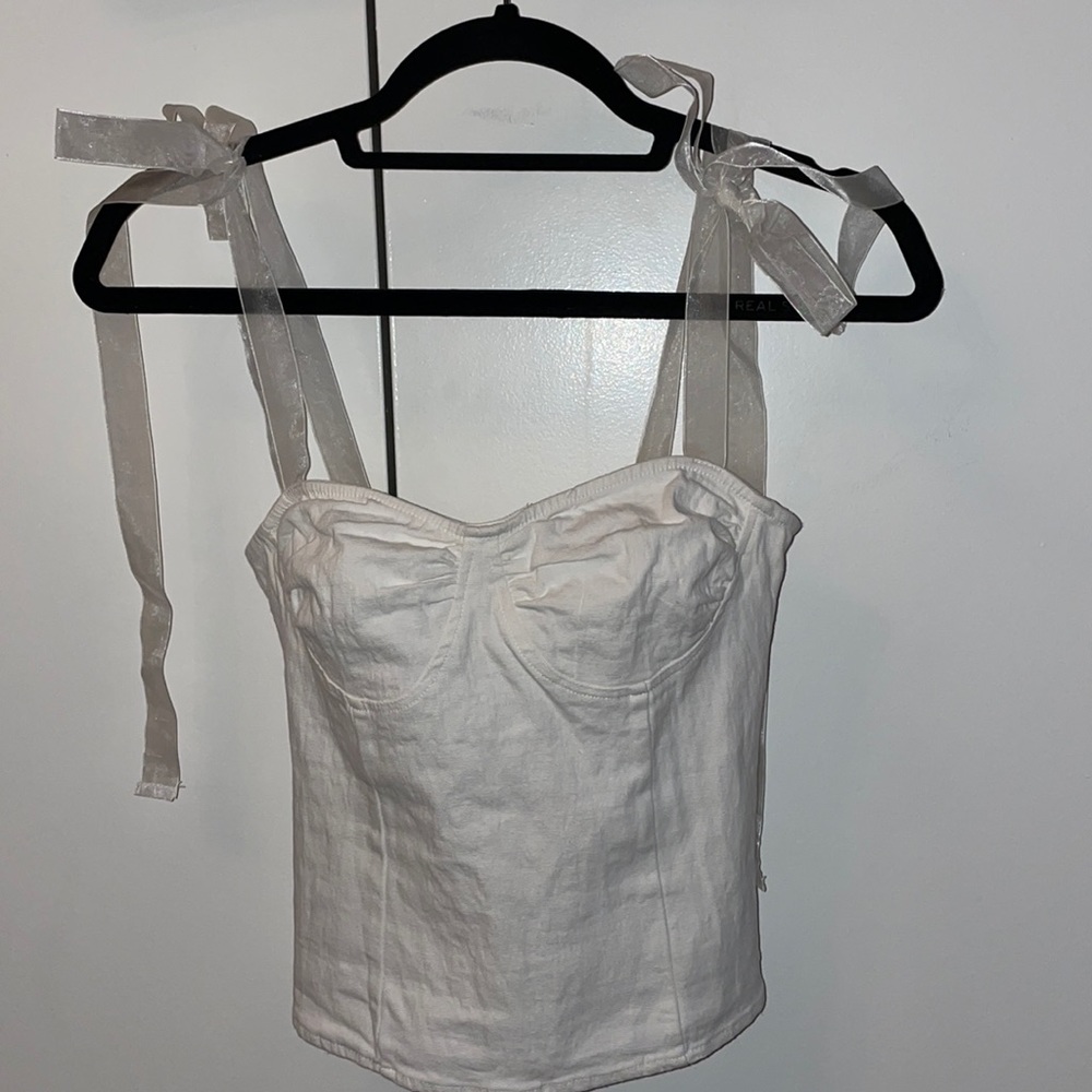 white fashion nova blouse with tie straps.
